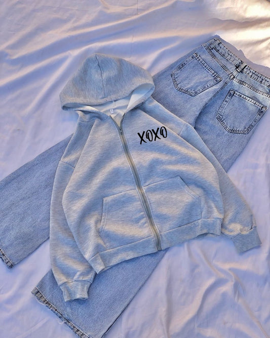 Light blue hoodie and jeans with 'XOXO' on a white background