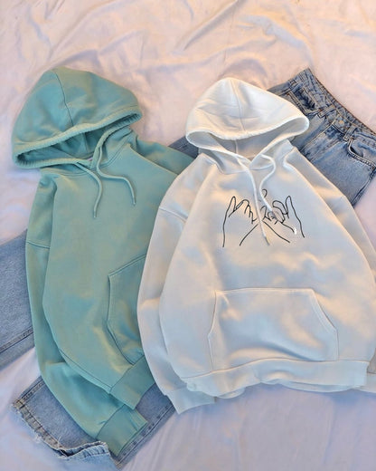 Two hoodies, one WHITE and one green, on a white background.